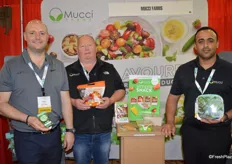 Steve Zaccardi, Rob Medcalf and Majid Radam with Mucci Farms show cucumber poppers and snackable sweet peppers.